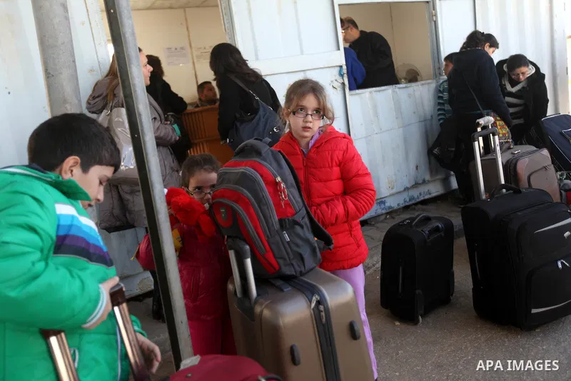 Palestinian Christians wait at the Erez crossing in the northern Gaza Strip on Dec. 24, 2012 after Israel granted 557 permits for Christians from the isolated and impoverished territory to travel to the West Bank town of...