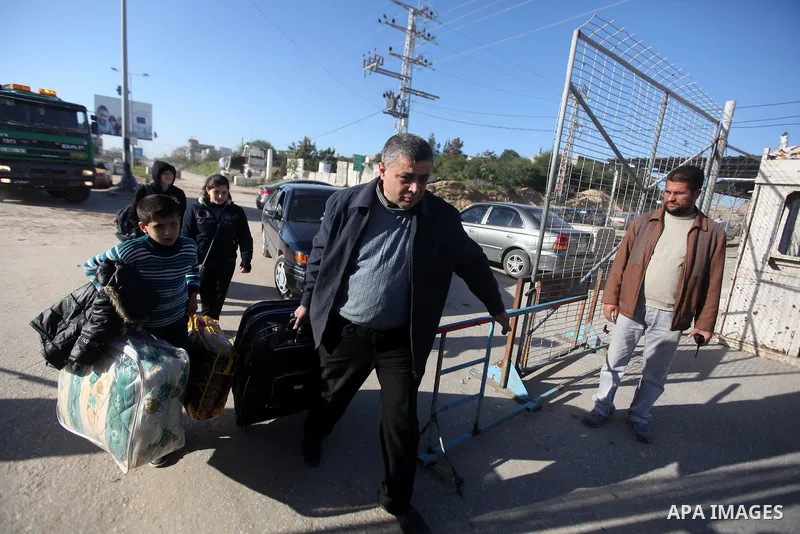 Palestinian Christians walk towards Erez crossing in the northern Gaza Strip on Dec. 24, 2012 after Israel granted 557 permits for Christians from the isolated and impoverished territory to travel to the West Bank town o...