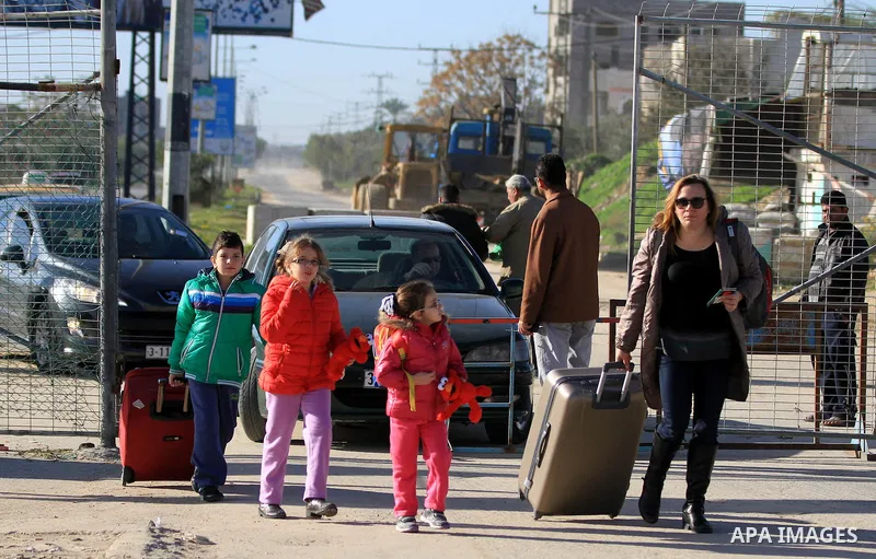 Palestinian Christians walk towards Erez crossing in the northern Gaza Strip on Dec. 24, 2012 after Israel granted 557 permits for Christians from the isolated and impoverished territory to travel to the West Bank town o...