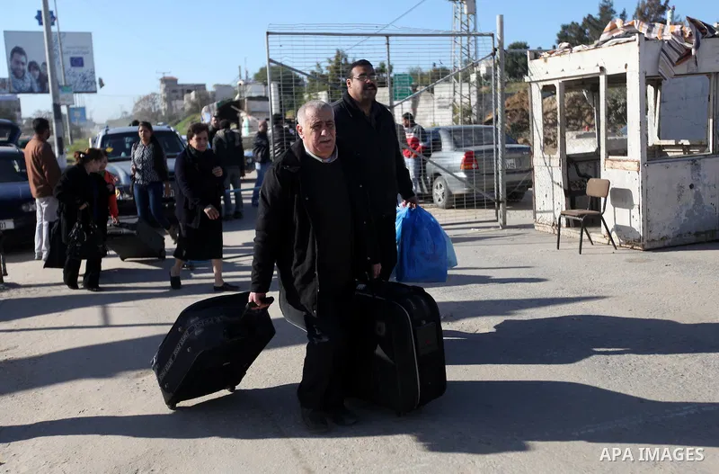 Palestinian Christians walk towards Erez crossing in the northern Gaza Strip on Dec. 24, 2012 after Israel granted 557 permits for Christians from the isolated and impoverished territory to travel to the West Bank town o...