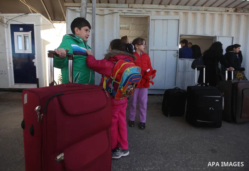 Palestinian Christians wait at the Erez crossing in the northern Gaza Strip on Dec. 24, 2012 after Israel granted 557 permits for Christians from the isolated and impoverished territory to travel to the West Bank town of...