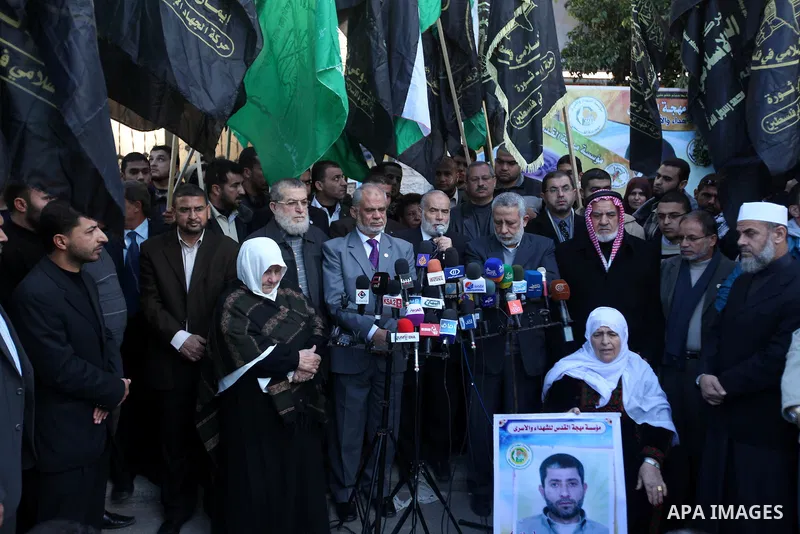 Palestinian members of National and Islamic movements speak during a rally in Gaza city on December 24, 2012. in solidarity with hunger-striking detainees held by Israel to demand their release from detention without tri...