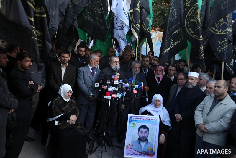 Palestinian members of National and Islamic movements speak during a rally in Gaza city on December 24, 2012. in solidarity with hunger-striking detainees held by Israel to demand their release from detention without tri...
