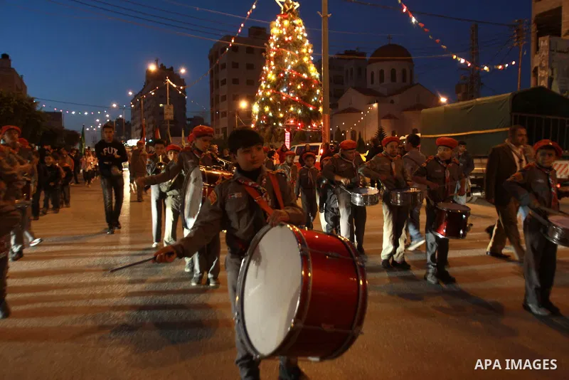 Palestinian scout marching band parades as they attend the Christmas celebrations in the West Bank city of Nablus on Dec. 24, 2012. Photo by Nedal Eshtayah