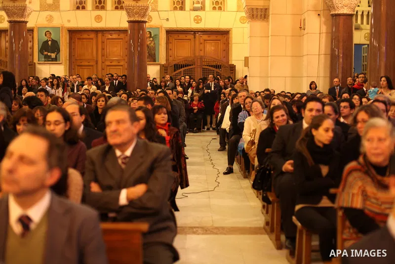 Christians attend Christmas mass in Cairo, on December 24, 2012. Photo by Ashraf Amra