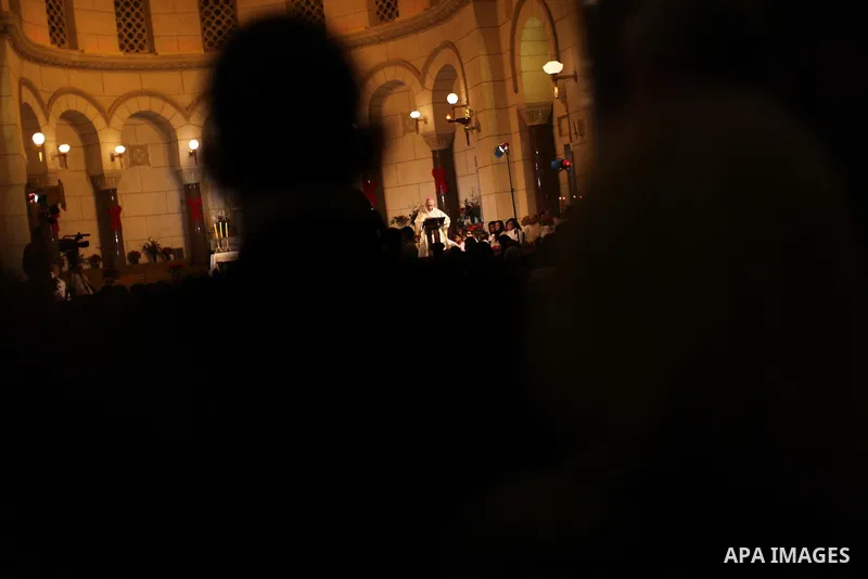 Christians attend Christmas mass in Cairo, on December 24, 2012. Photo by Ashraf Amra