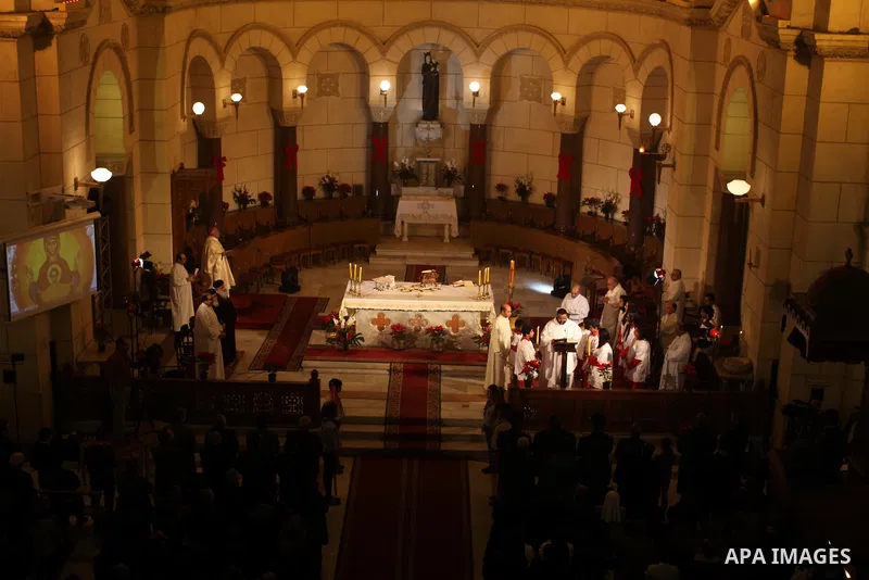 Christians attend Christmas mass in Cairo, on December 24, 2012. Photo by Ashraf Amra