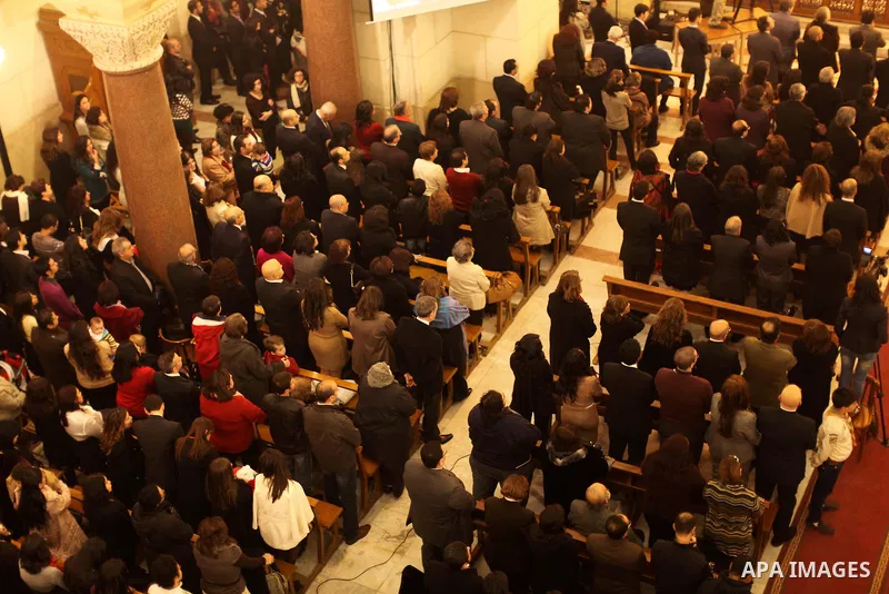 Christians attend Christmas mass in Cairo, on December 24, 2012. Photo by Ashraf Amra