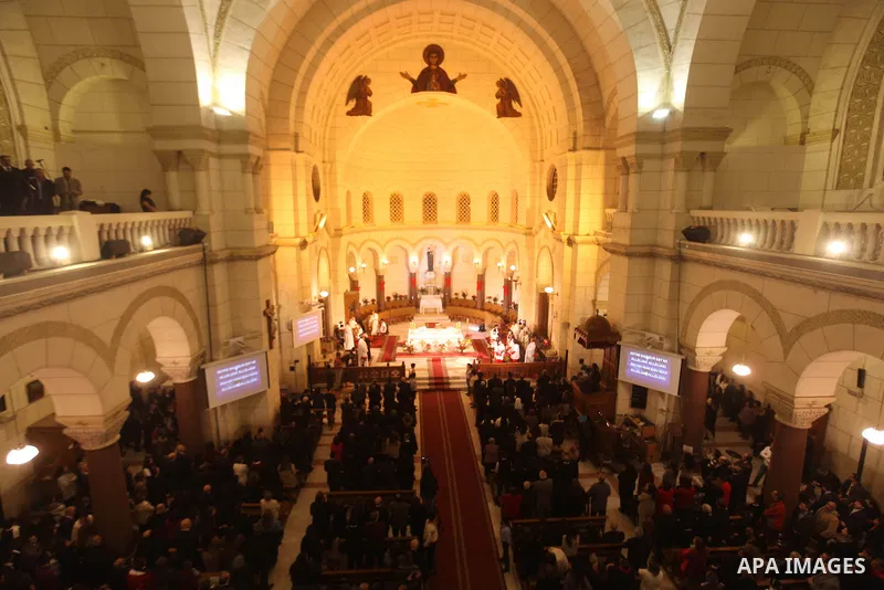 Christians attend Christmas mass in Cairo, on December 24, 2012. Photo by Ashraf Amra