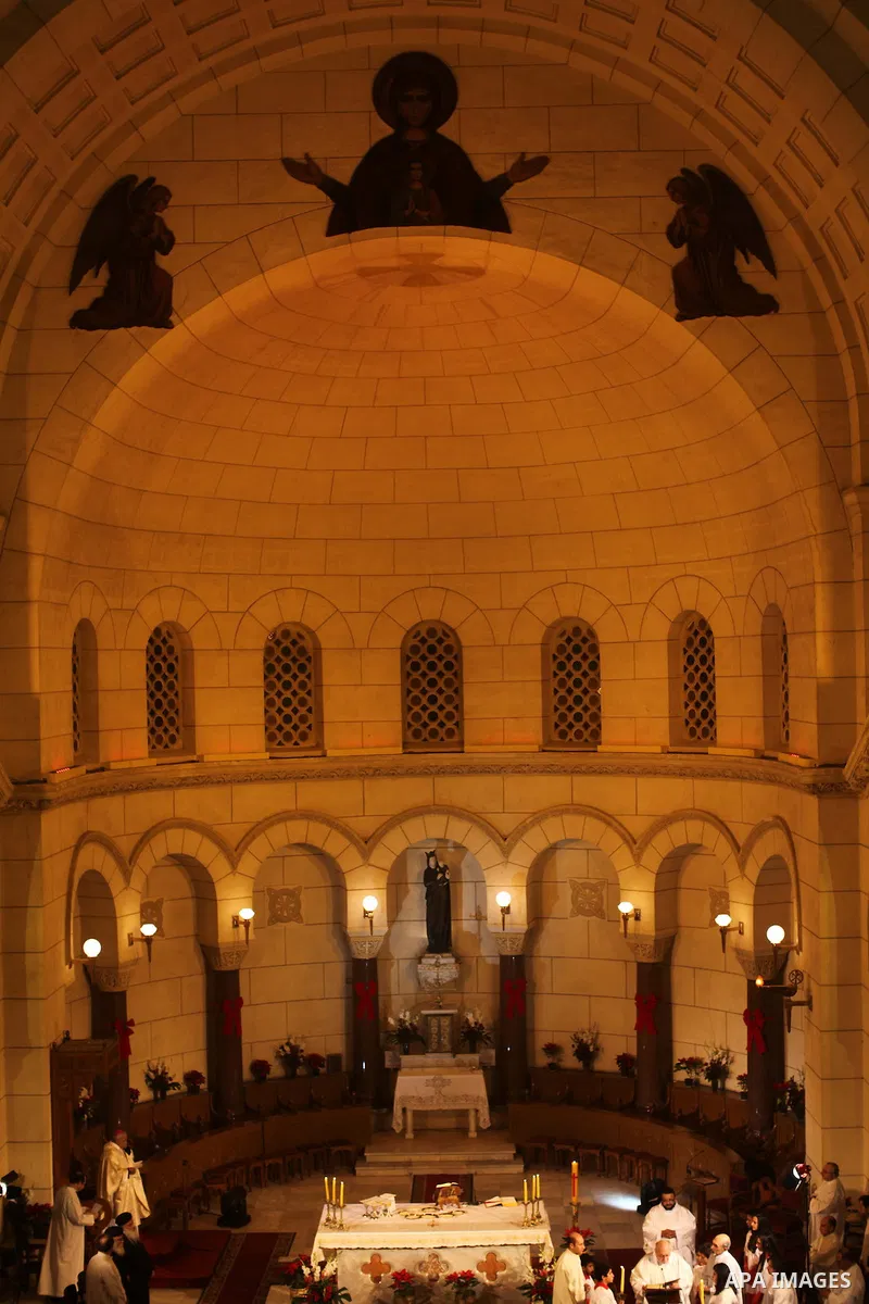 Christians attend Christmas mass in Cairo, on December 24, 2012. Photo by Ashraf Amra