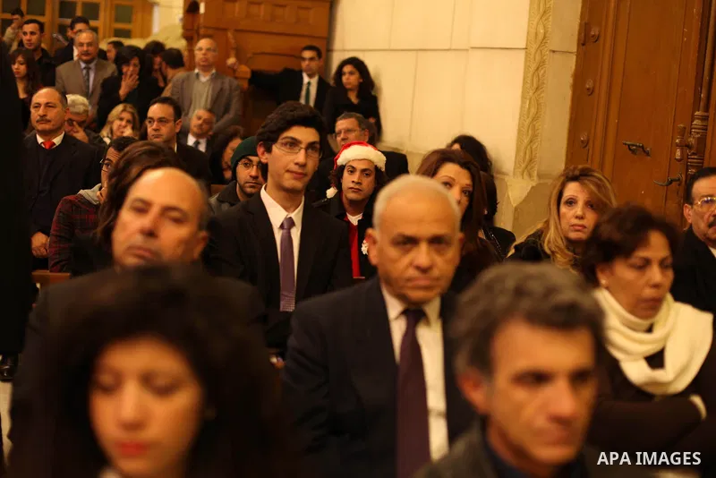 Christians attend Christmas mass in Cairo, on December 24, 2012. Photo by Ashraf Amra