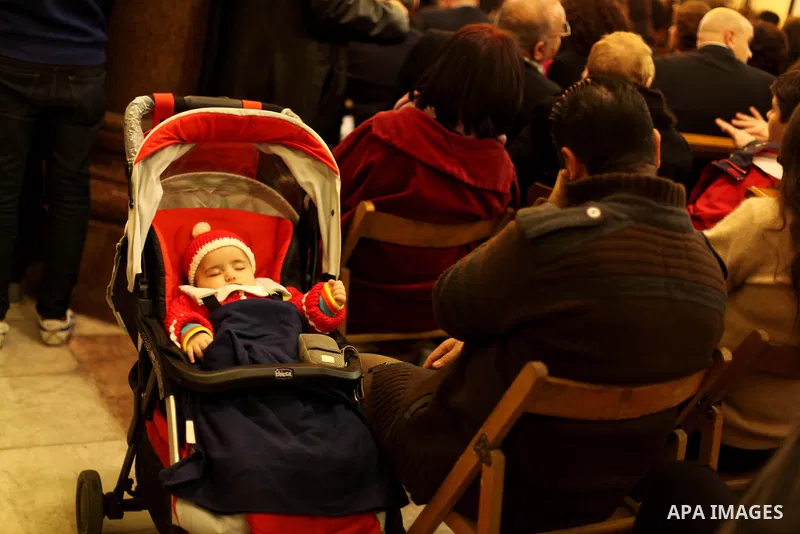 Christians attend Christmas mass in Cairo, on December 24, 2012. Photo by Ashraf Amra