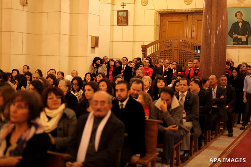 Christians attend Christmas mass in Cairo, on December 24, 2012. Photo by Ashraf Amra