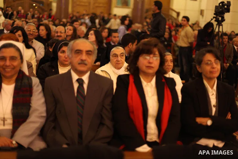 Christians attend Christmas mass in Cairo, on December 24, 2012. Photo by Ashraf Amra