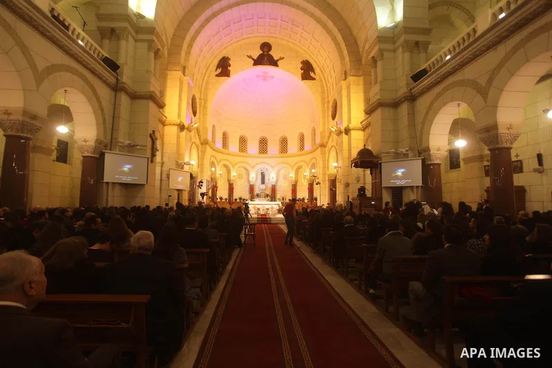 Christians attend Christmas mass in Cairo, on December 24, 2012. Photo by Ashraf Amra