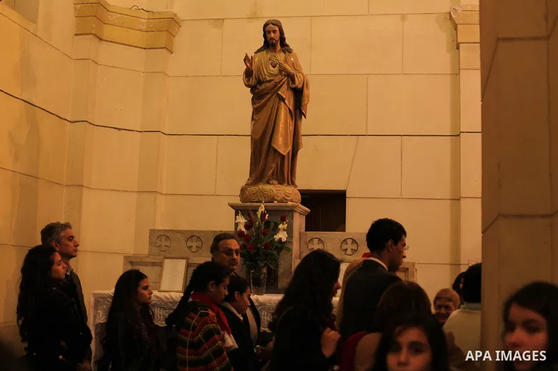 Christians attend Christmas mass in Cairo, on December 24, 2012. Photo by Ashraf Amra