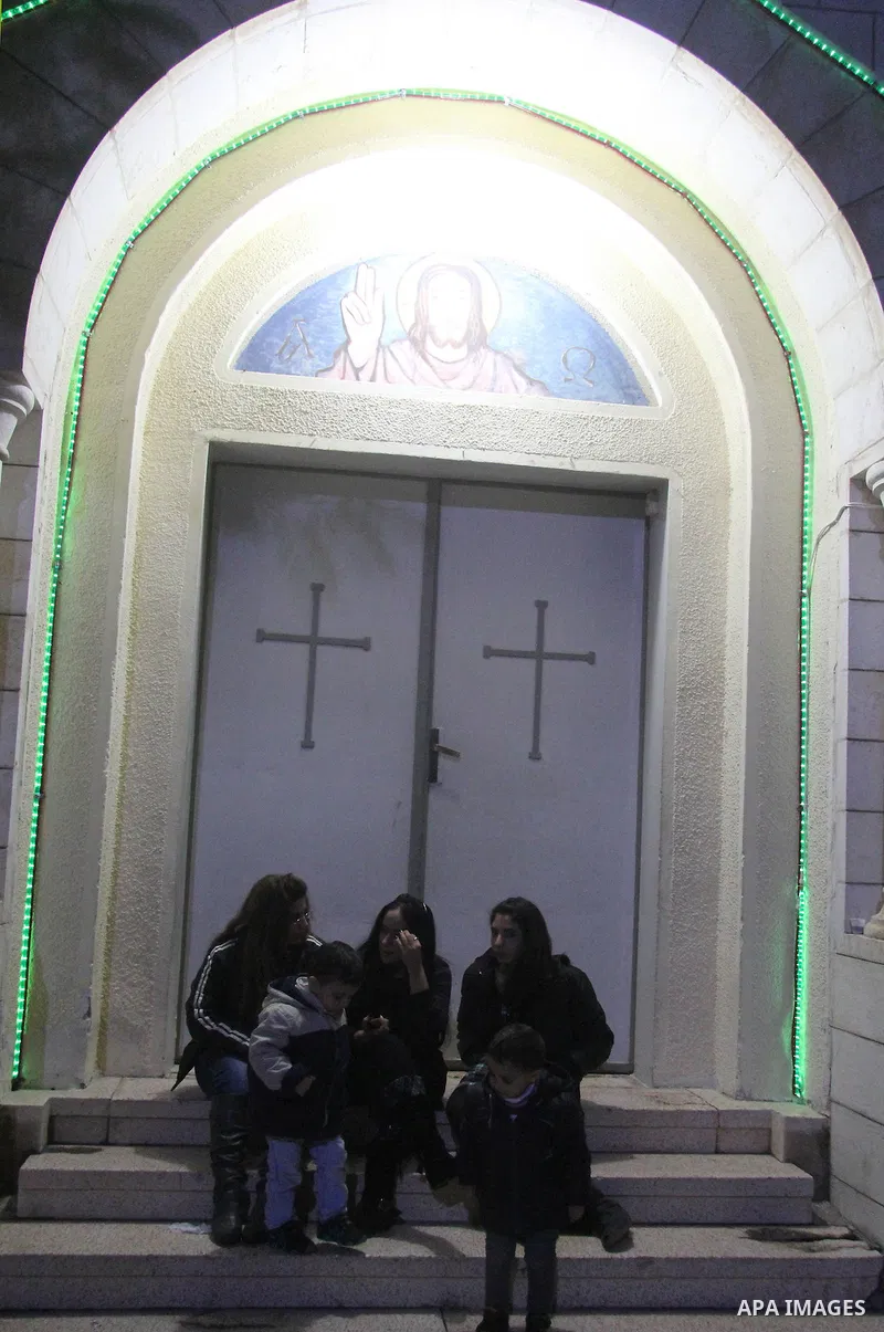 Palestinians Christian take part in the celebrations at a church of Deir Latin, during Christmas celebrations in Gaza city, on December 24, 2012. Photo by Ezz al-Zanoon