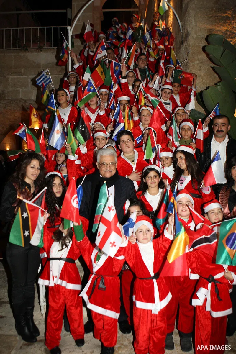 Palestinian President Mahmoud Abbas (Abu Mazen) participate in a Greek Orthodox ceremony for the victory of Palestine at the United Nations, in the West Bank city of Bethlehem, on Dec. 24, 2012. Photo by Thaer Ganaim