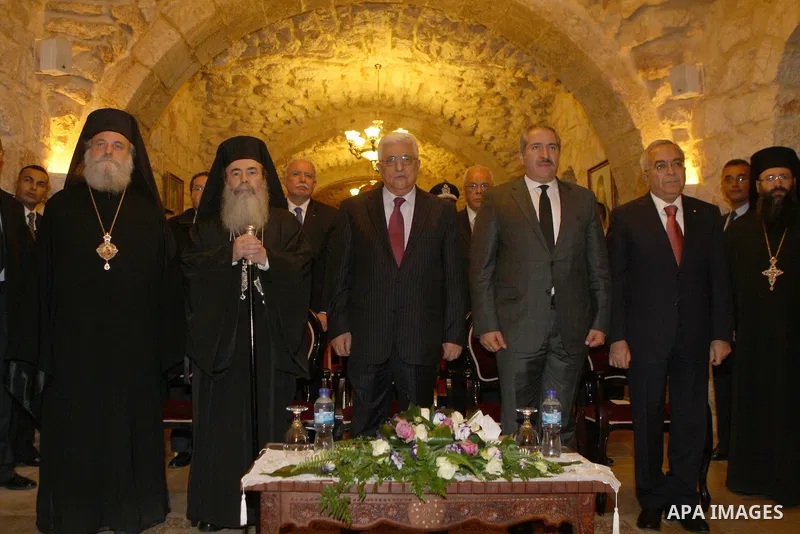 Palestinian President Mahmoud Abbas (Abu Mazen) participate in a Greek Orthodox ceremony for the victory of Palestine at the United Nations, in the West Bank city of Bethlehem, on Dec. 24, 2012. Photo by Thaer Ganaim
