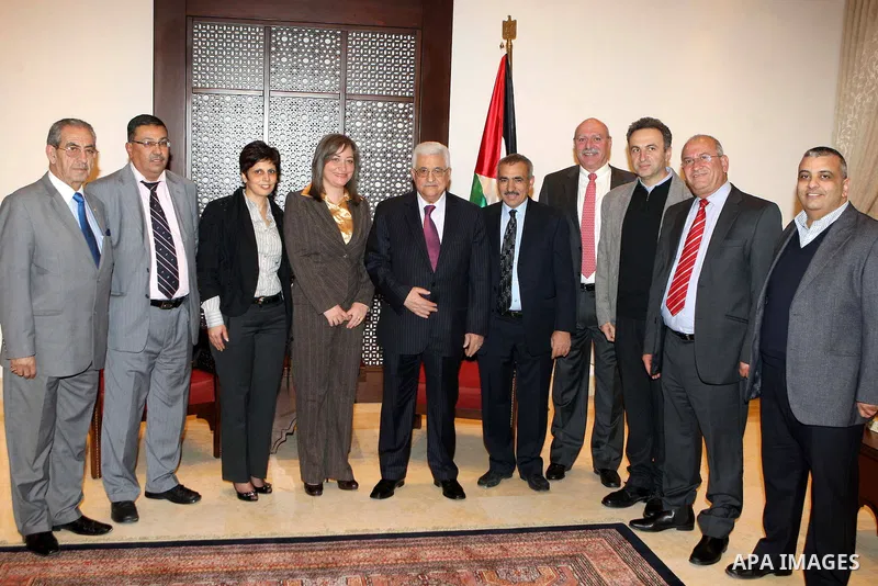 Palestinian President Mahmoud Abbas (Abu Mazen) meets with the members of the Tourism Advisory Council headed by the Minister of Tourism and Antiquities Rola Maiah, in the West Bank city of Bethlehem, on Dec. 24, 2012. P...
