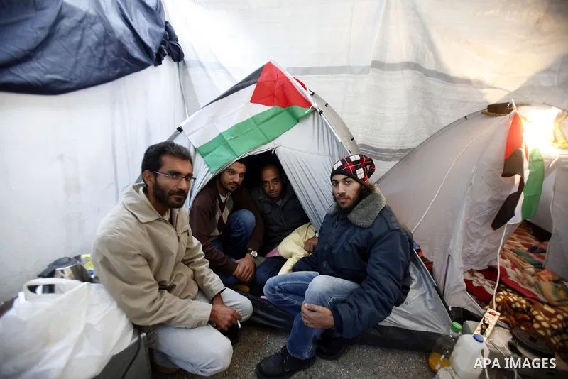 Palestinian youths sit in a tent during a hunger strike sit-in in Jerusalem. 25 December 2012, in solidarity with hunger-striking detainees held by Israel to demand their release from detention without trial. Photo by Ma...