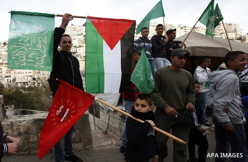 Palestinians celebrate after the Israeli authorities released prisoner Mousa Oudeh from neighborhood of Silwan in Jerusalem on December 26, 2012. Oudeh is a member of the committee for the defense of Silwan, spent two mo...