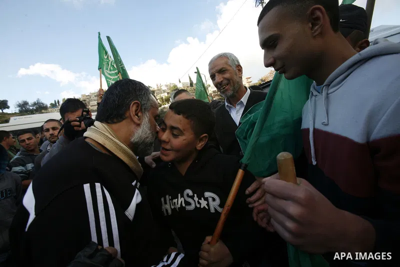 Palestinians celebrate after the Israeli authorities released prisoner Mousa Oudeh from neighborhood of Silwan in Jerusalem on December 26, 2012. Oudeh is a member of the committee for the defense of Silwan, spent two mo...