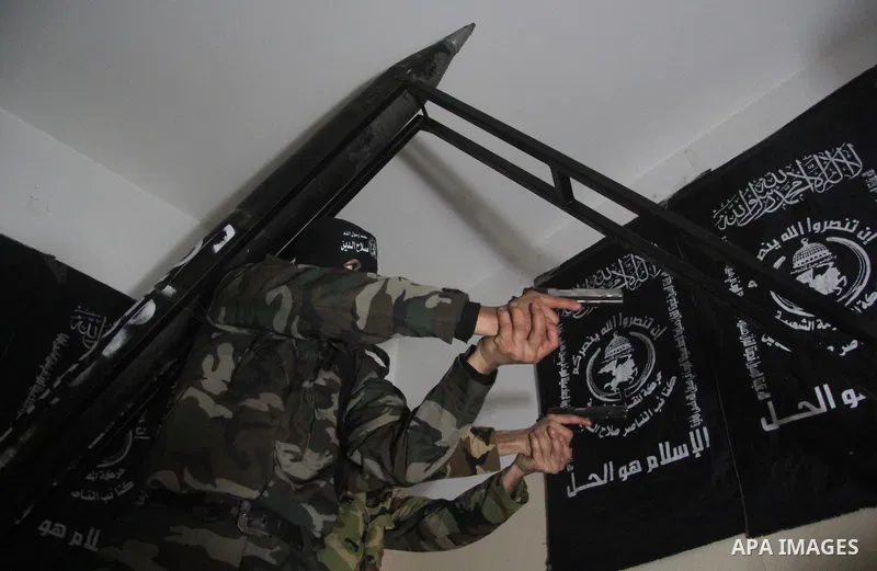 Militants of El-Naser Salah El-Deen brigades of the popular resistance, during they prefabricate a homemade rockets named (Al Naser 5) , marking the 4 th anniversary of the Israel-Gaza war, in Gaza City, on Dec. 27, 2012...