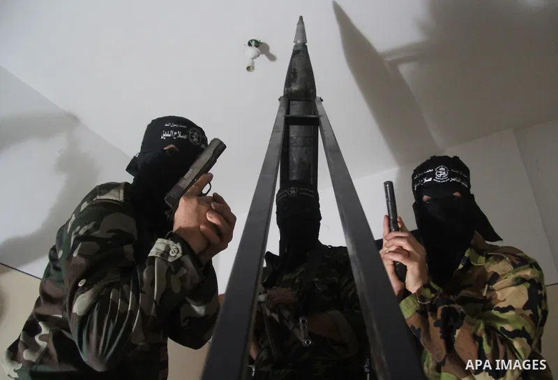 Militants of El-Naser Salah El-Deen brigades of the popular resistance, during they prefabricate a homemade rockets named (Al Naser 5) , marking the 4 th anniversary of the Israel-Gaza war, in Gaza City, on Dec. 27, 2012...