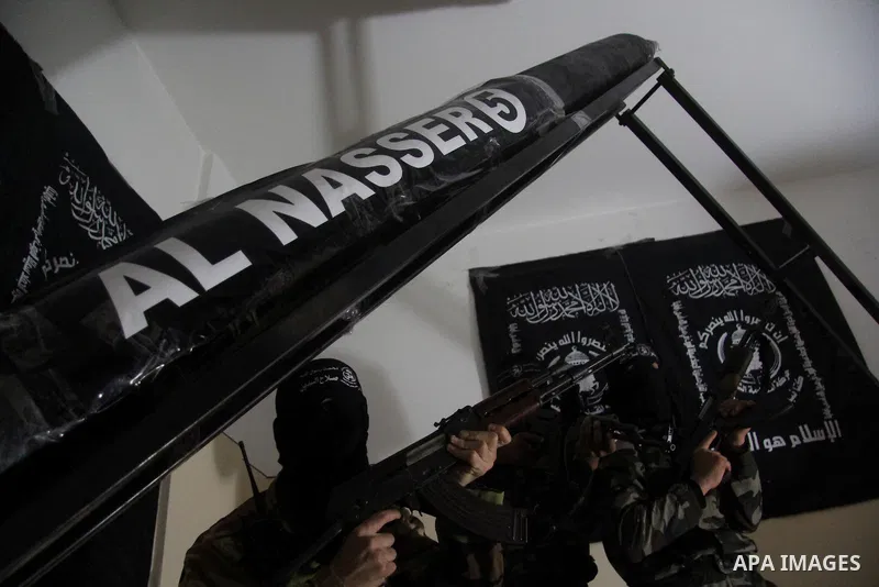 Militants of El-Naser Salah El-Deen brigades of the popular resistance, during they prefabricate a homemade rockets named (Al Naser 5) , marking the 4 th anniversary of the Israel-Gaza war, in Gaza City, on Dec. 27, 2012...