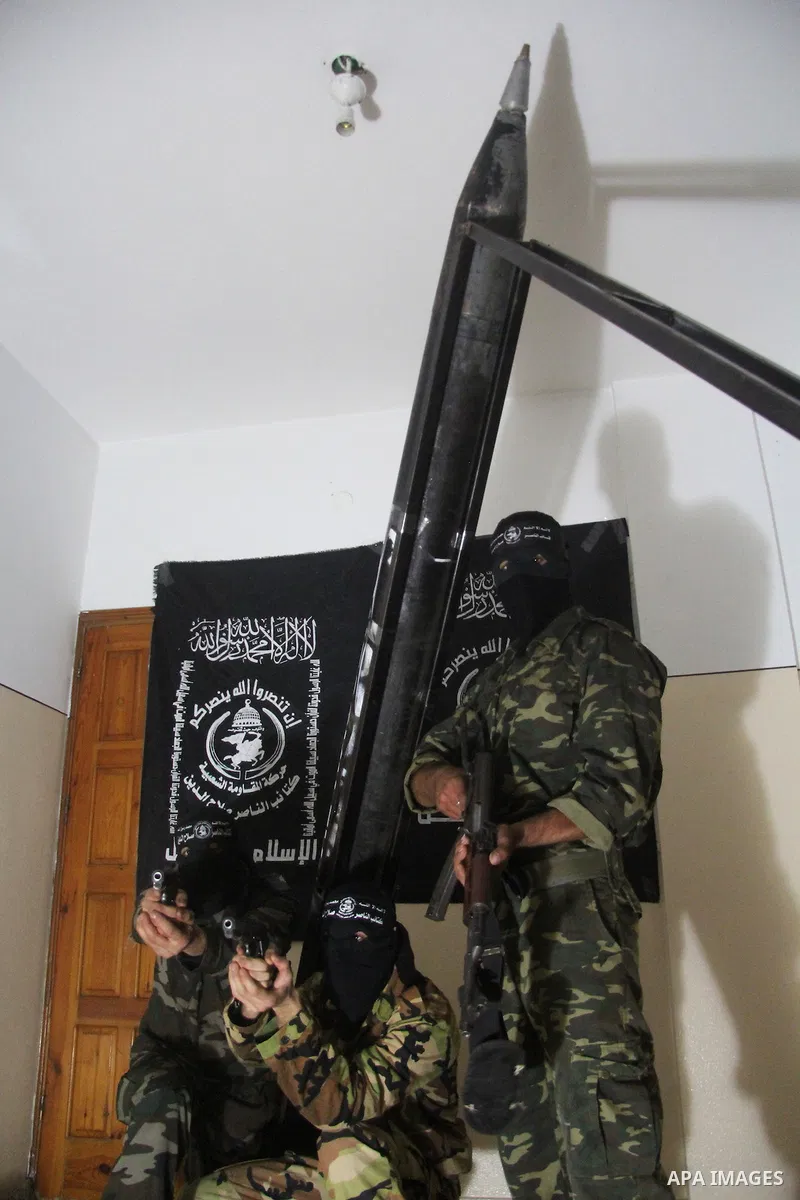 Militants of El-Naser Salah El-Deen brigades of the popular resistance, during they prefabricate a homemade rockets named (Al Naser 5) , marking the 4 th anniversary of the Israel-Gaza war, in Gaza City, on Dec. 27, 2012...