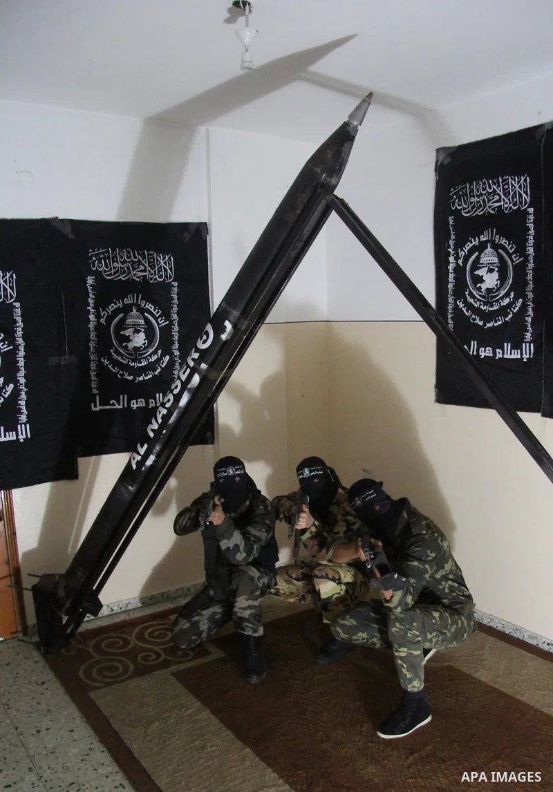 Militants of El-Naser Salah El-Deen brigades of the popular resistance, during they prefabricate a homemade rockets named (Al Naser 5) , marking the 4 th anniversary of the Israel-Gaza war, in Gaza City, on Dec. 27, 2012...