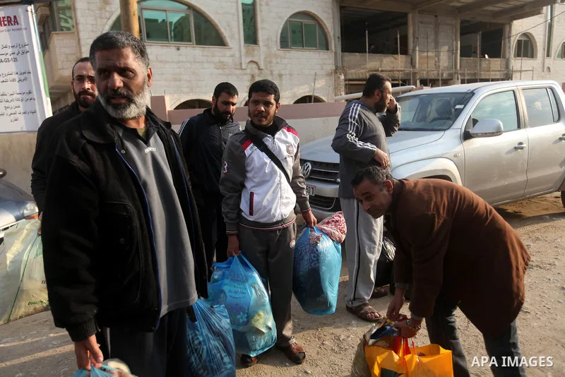 Palestinian prisoners out from a Hamas-run jail after released them in Gaza City on December 27, 2012. Hamas government has decided to pardon 26 prisoners six of them from the cases against Fatah members which are relate...