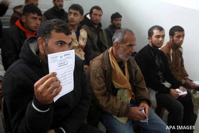 Palestinian prisoners gather before released from a Hamas-run jail in Gaza City on December 27, 2012. Hamas government has decided to pardon 26 prisoners six of them from the cases against Fatah members which are related...
