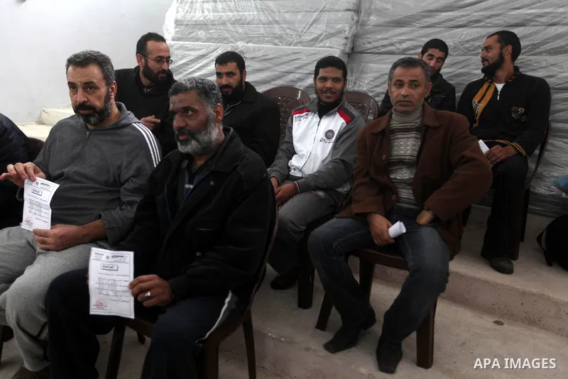 Palestinian prisoners gather before released from a Hamas-run jail in Gaza City on December 27, 2012. Hamas government has decided to pardon 26 prisoners six of them from the cases against Fatah members which are related...