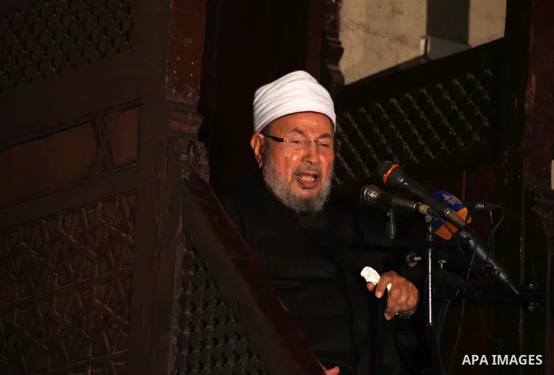 Egyptian cleric Sheikh Yusuf al-Qaradawi, chairman of the International Union of Muslim Scholars, leads Friday prayers before a protest against Syrian President Bashar al-Assad, at Al Azhar mosque in old Cairo December 2...