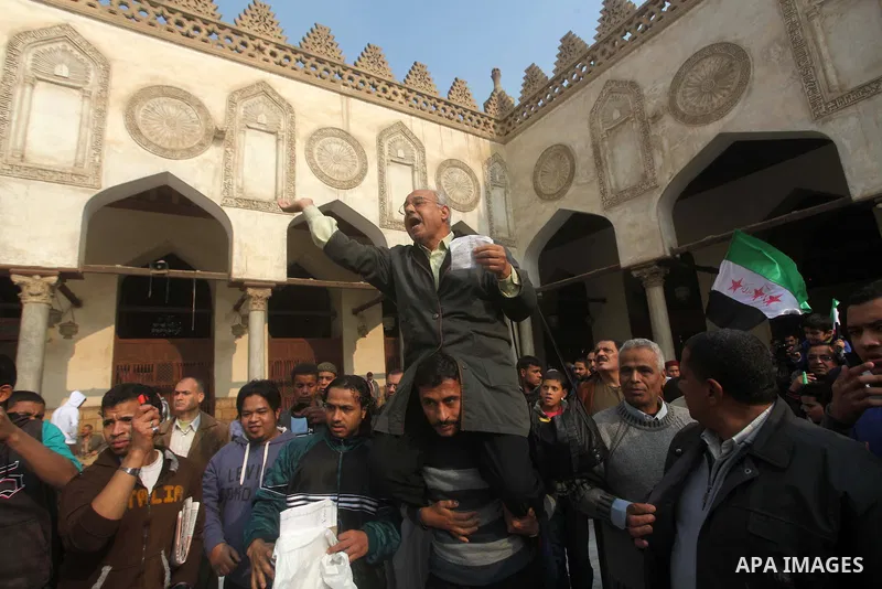 Egyptian protestors gather during a rally in support of the Syrian people and against Syria's President Bashar al-Assad at Al-Azhar mosque in Cairo, on December 28, 2012. Syrian warplanes launched air raids in Damascus p...