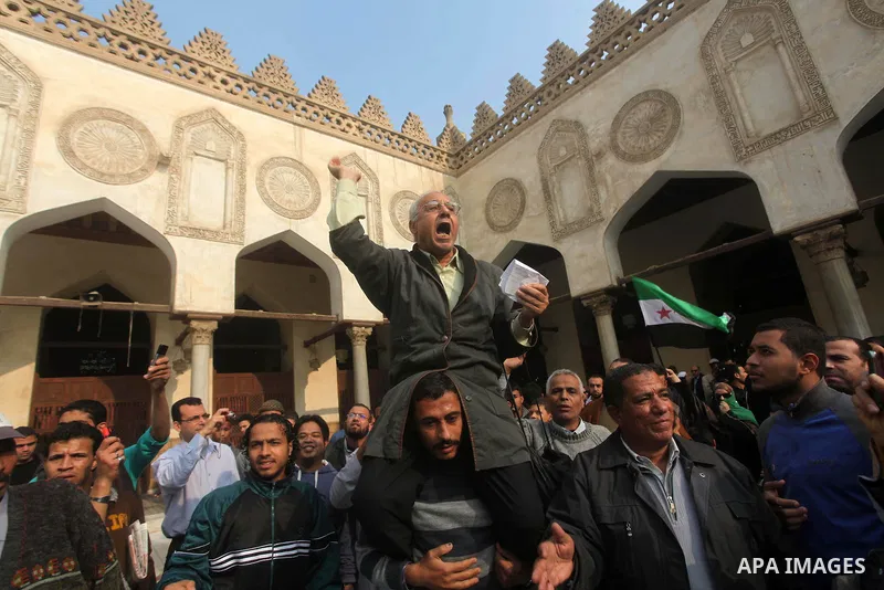 Egyptian protestors gather during a rally in support of the Syrian people and against Syria's President Bashar al-Assad at Al-Azhar mosque in Cairo, on December 28, 2012. Syrian warplanes launched air raids in Damascus p...
