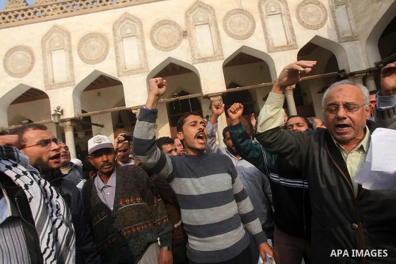 Egyptian protestors gather during a rally in support of the Syrian people and against Syria's President Bashar al-Assad at Al-Azhar mosque in Cairo, on December 28, 2012. Syrian warplanes launched air raids in Damascus p...