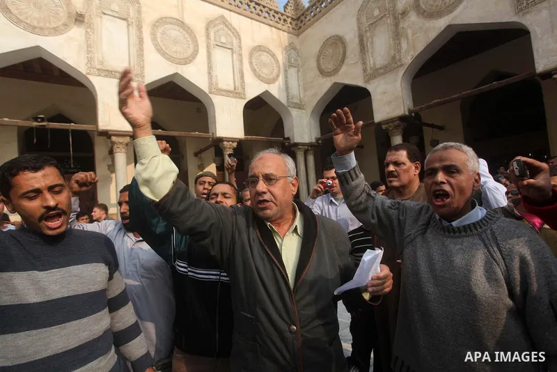 Egyptian protestors gather during a rally in support of the Syrian people and against Syria's President Bashar al-Assad at Al-Azhar mosque in Cairo, on December 28, 2012. Syrian warplanes launched air raids in Damascus p...