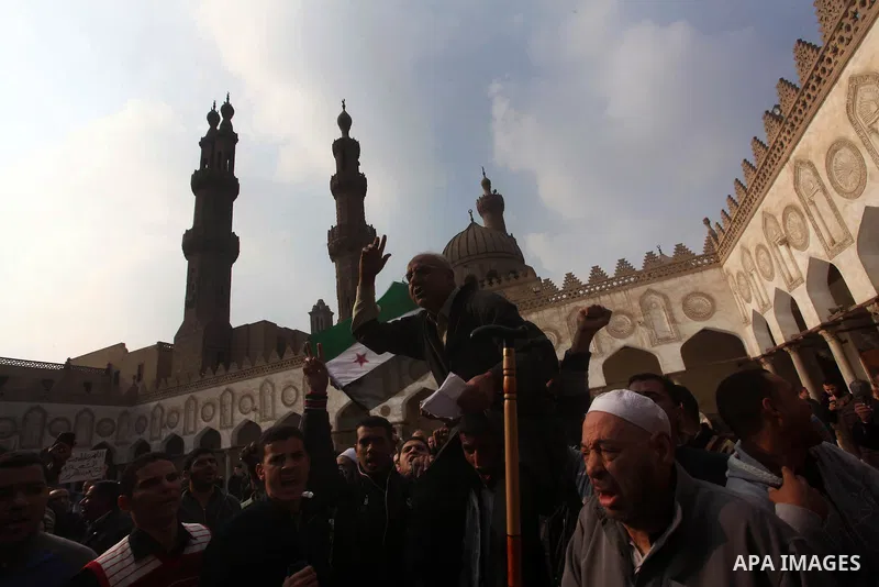 Egyptian protestors gather during a rally in support of the Syrian people and against Syria's President Bashar al-Assad at Al-Azhar mosque in Cairo, on December 28, 2012. Syrian warplanes launched air raids in Damascus p...