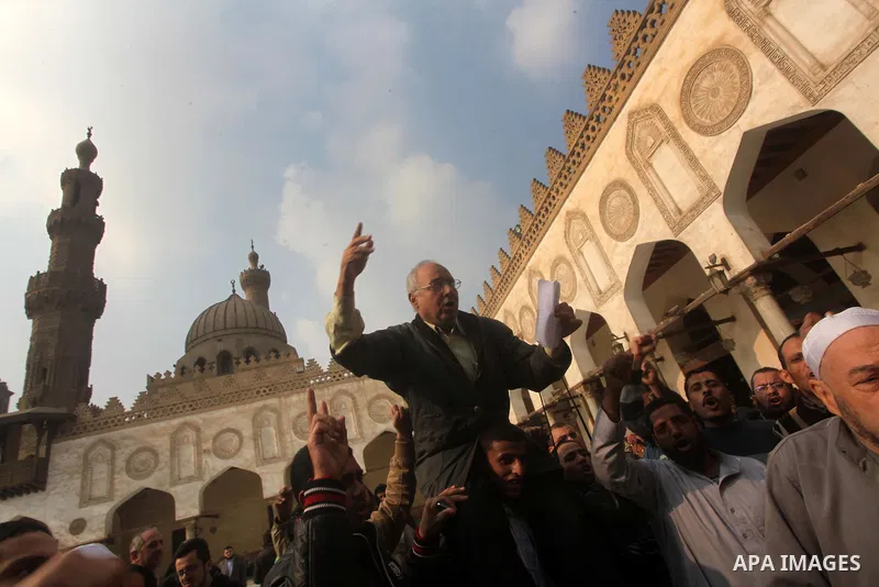 Egyptian protestors gather during a rally in support of the Syrian people and against Syria's President Bashar al-Assad at Al-Azhar mosque in Cairo, on December 28, 2012. Syrian warplanes launched air raids in Damascus p...