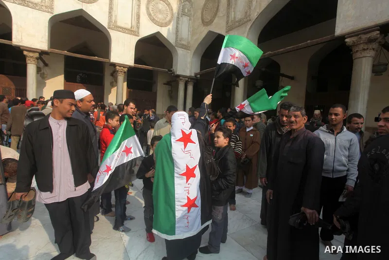 Egyptian protestors gather during a rally in support of the Syrian people and against Syria's President Bashar al-Assad at Al-Azhar mosque in Cairo, on December 28, 2012. Syrian warplanes launched air raids in Damascus p...