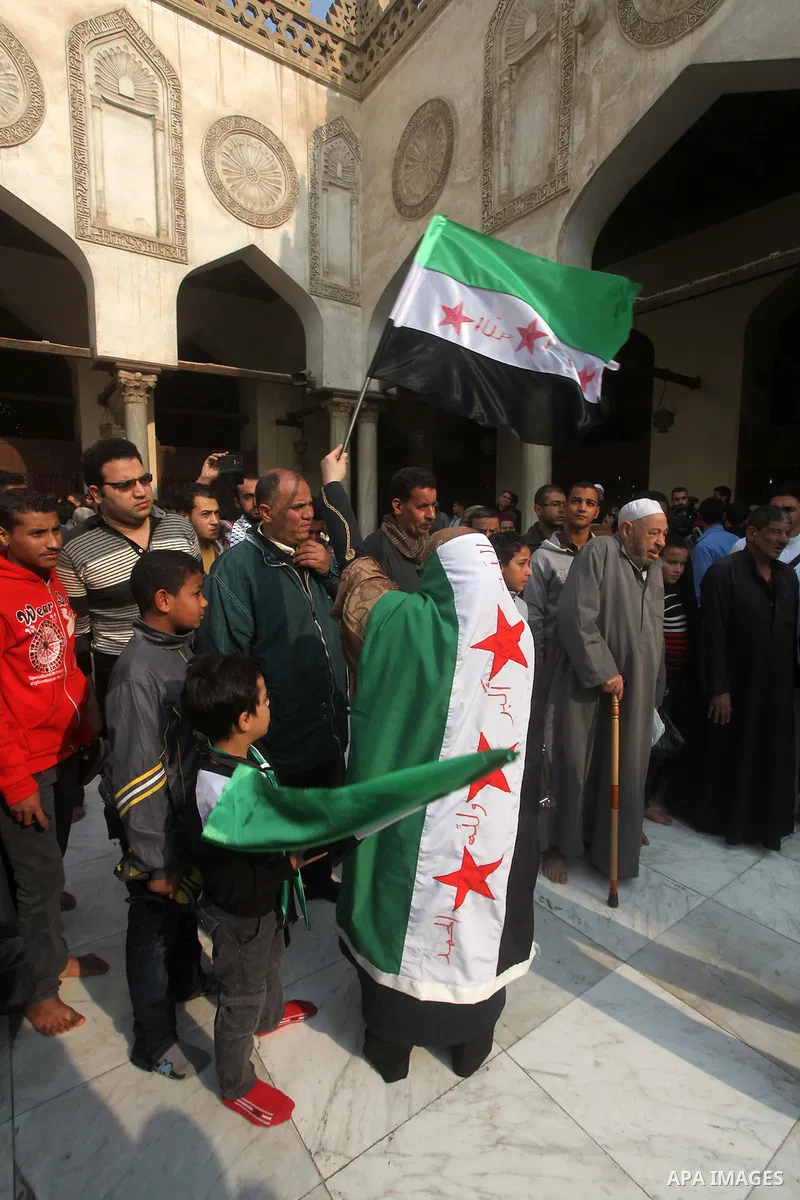 Egyptian protestors gather during a rally in support of the Syrian people and against Syria's President Bashar al-Assad at Al-Azhar mosque in Cairo, on December 28, 2012. Syrian warplanes launched air raids in Damascus p...