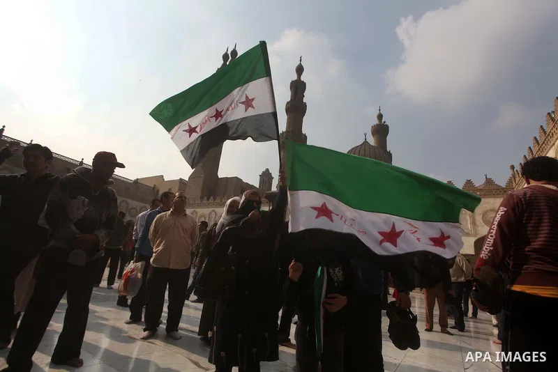 Egyptian protestors gather during a rally in support of the Syrian people and against Syria's President Bashar al-Assad at Al-Azhar mosque in Cairo, on December 28, 2012. Syrian warplanes launched air raids in Damascus p...