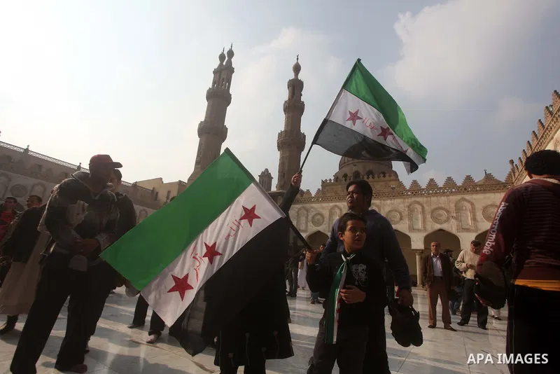 Egyptian protestors gather during a rally in support of the Syrian people and against Syria's President Bashar al-Assad at Al-Azhar mosque in Cairo, on December 28, 2012. Syrian warplanes launched air raids in Damascus p...