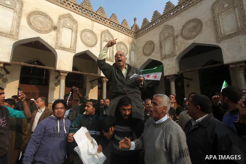 Egyptian protestors gather during a rally in support of the Syrian people and against Syria's President Bashar al-Assad at Al-Azhar mosque in Cairo, on December 28, 2012. Syrian warplanes launched air raids in Damascus p...