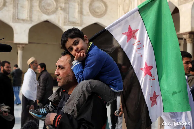 Egyptian protestors gather during a rally in support of the Syrian people and against Syria's President Bashar al-Assad at Al-Azhar mosque in Cairo, on December 28, 2012. Syrian warplanes launched air raids in Damascus p...