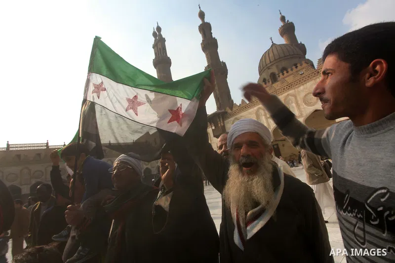 Egyptian protestors gather during a rally in support of the Syrian people and against Syria's President Bashar al-Assad at Al-Azhar mosque in Cairo, on December 28, 2012. Syrian warplanes launched air raids in Damascus p...