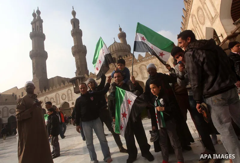 Egyptian protestors gather during a rally in support of the Syrian people and against Syria's President Bashar al-Assad at Al-Azhar mosque in Cairo, on December 28, 2012. Syrian warplanes launched air raids in Damascus p...
